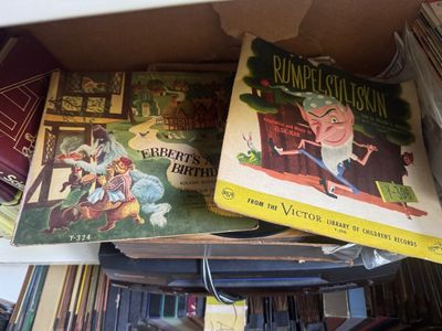 Sale Photo Thumbnail #63: Vintage RCA Victor children's records, including "Rumpelstiltskin" (Y-306) and "Herbert's Birthday" (Y-324), showing some wear on the illustrated paper sleeves.