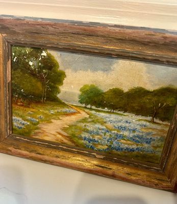 Vintage oil painting depicting a Texas bluebonnet landscape with a dirt path, housed in a distressed wooden frame.