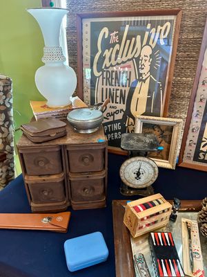 Assortment of vintage collectibles including a small wooden four-drawer chest, a frosted glass lamp, a vintage kitchen scale, and framed...