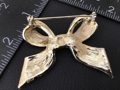 Vintage Gold Tone and White Enamel Bow Brooch