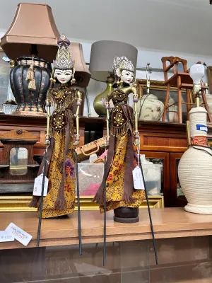 Sale Photo Thumbnail #7: Pair of vintage Indonesian Wayang Golek rod puppets, featuring hand-painted wooden faces, elaborate headdresses, and traditional batik and beaded clothing.