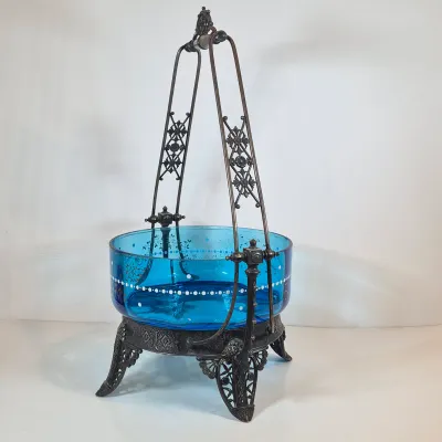LOT 33: Antique Hand Painted Blue Glass Bowl on Ornate Silverplate Basket Stand from James W, Tufts