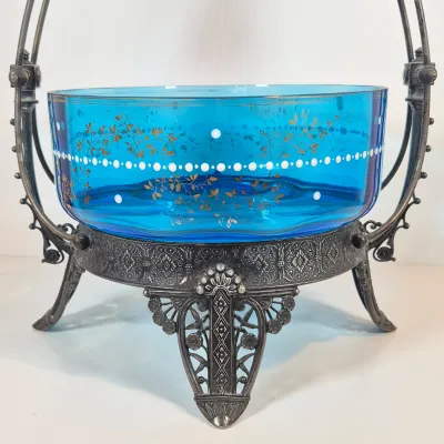 LOT 33: Antique Hand Painted Blue Glass Bowl on Ornate Silverplate Basket Stand from James W, Tufts