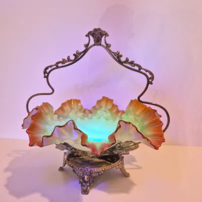 LOT 49: Victorian Bride's Bowl with Uranium Glass Crimped Bowl in Homan Silverplate Base
