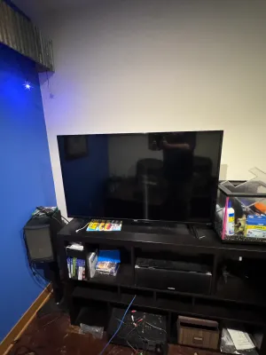 TCL Flat Screen Television with Stand Legs