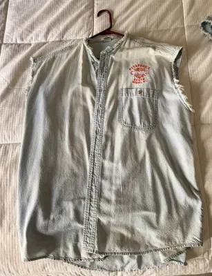 Vintage light-wash denim sleeveless shirt featuring a Peterson's Harley-Davidson South Miami, FL embroidered logo above the chest...