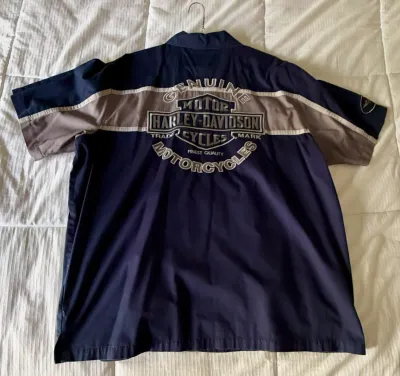 Harley-Davidson short-sleeve button-up shirt in navy blue and grey, featuring a large embroidered logo on the back.
