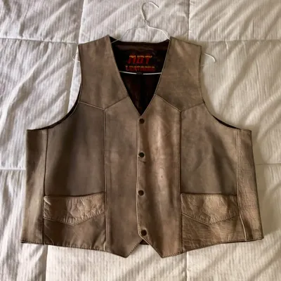 Hot Leathers brown leather motorcycle vest with snap-front closure and western-style yokes, showing light wear.