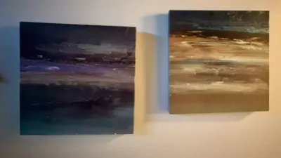 Pair of contemporary abstract landscape paintings on canvas, featuring textured brushstrokes in earthy and cool tones.