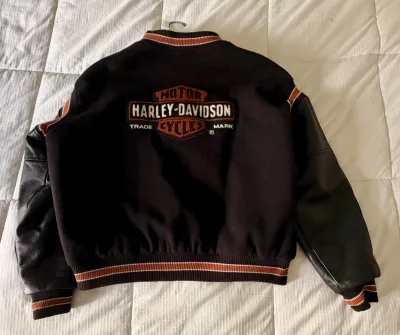 Vintage Harley-Davidson varsity jacket featuring a black wool body, black leather sleeves, and embroidered logo on the back.