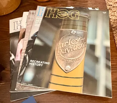 Stack of vintage HOG (Harley Owners Group) magazines, featuring the 2019 issue 046 on top.