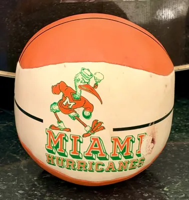 Vintage Miami Hurricanes basketball featuring Sebastian the Ibis mascot graphics, showing some minor wear and scuffs.