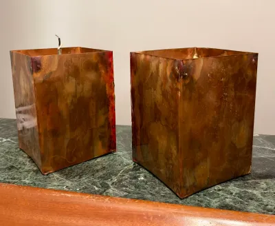 Pair of vintage square copper light fixtures or sconces with a rich, mottled patina, showing some wear and exposed wiring.