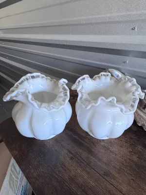 Sale Photo Thumbnail #107: A matching pair of vintage Fenton Art Glass 'Silver Crest' melon-shaped vases. These pieces feature a classic milk glass body with a ruffled, double-crimped rim accented by a clear glass edge. Made in the USA. Both vases are in good vintage condition with
