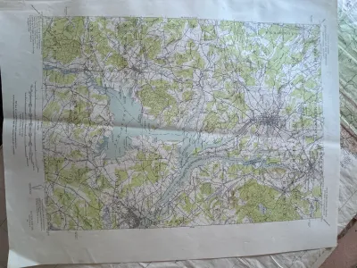 Sale Photo Thumbnail #202: An authentic vintage United States Geological Survey (USGS) topographic map of the Dover, N.H.-ME. quadrangle. Originally surveyed in 1916, this edition features a polyconic projection based on the North American datum. It details geographic features, roa