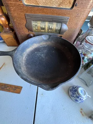 Sale Photo Thumbnail #273: A vintage Wagner Ware Sidney -O- cast iron skillet, size #6. Features the classic stylized logo on the bottom with the number '6' below it. The handle is marked with '6' on the top side. Made in the USA (Sidney, Ohio). The skillet shows signs of age and u