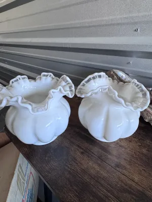 Sale Photo Thumbnail #105: A matching pair of vintage Fenton Art Glass 'Silver Crest' melon-shaped vases. These pieces feature a classic milk glass body with a ruffled, double-crimped rim accented by a clear glass edge. Made in the USA. Both vases are in good vintage condition with