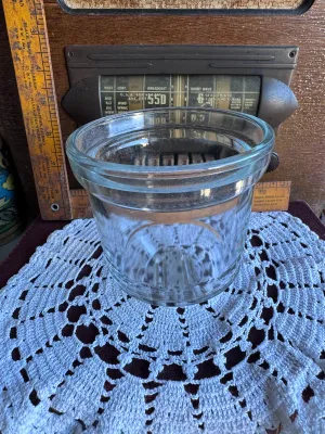Sale Photo Thumbnail #242: A vintage replacement glass jar for a Dazey Churn No. 40. This heavy, clear glass jar features the characteristic round body with a wide mouth and the distinctive raised glass guide bars on the bottom interior/exterior base. It is in excellent vintage con