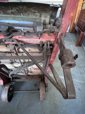 Sale Photo Thumbnail #19: An authentic antique Fairbanks wooden hand truck scale, combining a heavy-duty warehouse dolly with an integrated mechanical platform scale. Features a sturdy wood-plank bed, curved wooden handles, cast iron wheels, and the original mechanical weighing me