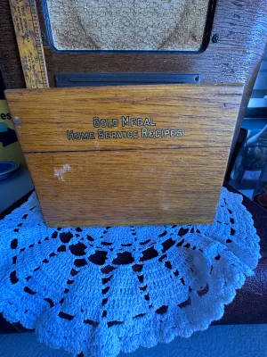 Sale Photo Thumbnail #67: An antique/vintage wooden recipe box featuring 'Gold Medal Home Service Recipes' on the front. The interior lid features original advertising for Washburn-Crosby Co. Gold Medal Foods and Betty Crocker 'Kitchen-tested' flour. Includes vintage recipe divide