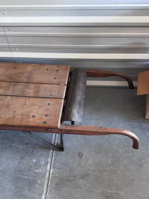Sale Photo Thumbnail #17: An authentic antique Fairbanks wooden hand truck scale, combining a heavy-duty warehouse dolly with an integrated mechanical platform scale. Features a sturdy wood-plank bed, curved wooden handles, cast iron wheels, and the original mechanical weighing me