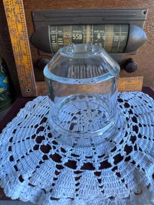 Sale Photo Thumbnail #240: A vintage replacement glass jar for a Dazey Churn No. 40. This heavy, clear glass jar features the characteristic round body with a wide mouth and the distinctive raised glass guide bars on the bottom interior/exterior base. It is in excellent vintage con