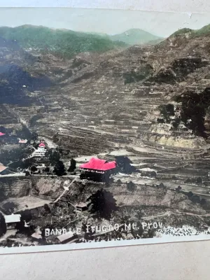 Sale Photo Thumbnail #166: A vintage multi-panel panoramic fold-out postcard featuring the famous Banaue Rice Terraces in Ifugao, Mountain Province, Philippines. The piece features hand-tinted style color photography depicting the terraced mountainside, traditional huts, and local 