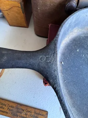 Sale Photo Thumbnail #274: A vintage Wagner Ware Sidney -O- cast iron skillet, size #6. Features the classic stylized logo on the bottom with the number '6' below it. The handle is marked with '6' on the top side. Made in the USA (Sidney, Ohio). The skillet shows signs of age and u