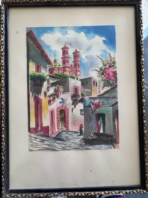 Sale Photo Thumbnail #213: A beautiful pair of original mid-century watercolor paintings depicting vibrant street scenes of Taxco, Mexico. Each piece is signed by the artist 'Max V.' in the lower corner. One painting features a cobblestone street leading toward the iconic Santa Pri