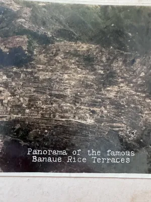 Sale Photo Thumbnail #163: A vintage multi-panel panoramic fold-out postcard featuring the famous Banaue Rice Terraces in Ifugao, Mountain Province, Philippines. The piece features hand-tinted style color photography depicting the terraced mountainside, traditional huts, and local 
