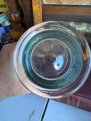 Sale Photo Thumbnail #292: A vintage clear glass battery jar manufactured by Whitall Tatum Co. in Millville, New Jersey. The jar features the embossed script "Whitall" on the front side and is embossed on the bottom rim with "WHITALL TATUM CO. MILLVILLE N.J. U.S.A.". It stands appr
