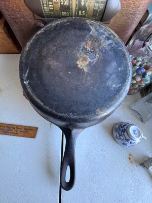 Sale Photo Thumbnail #271: A vintage Wagner Ware Sidney -O- cast iron skillet, size #6. Features the classic stylized logo on the bottom with the number '6' below it. The handle is marked with '6' on the top side. Made in the USA (Sidney, Ohio). The skillet shows signs of age and u