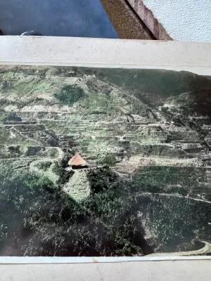 Sale Photo Thumbnail #165: A vintage multi-panel panoramic fold-out postcard featuring the famous Banaue Rice Terraces in Ifugao, Mountain Province, Philippines. The piece features hand-tinted style color photography depicting the terraced mountainside, traditional huts, and local 