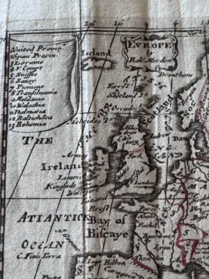 Sale Photo Thumbnail #101: An antique copperplate engraved map titled 'Europe' by the notable English cartographer Robert Morden (c. 1650–1703). This miniature map features hand-colored outlines in red/pink, showing the European continent, parts of North Africa, and 'Moscovia' (R