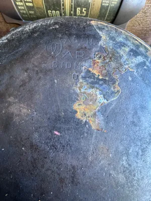 Sale Photo Thumbnail #272: A vintage Wagner Ware Sidney -O- cast iron skillet, size #6. Features the classic stylized logo on the bottom with the number '6' below it. The handle is marked with '6' on the top side. Made in the USA (Sidney, Ohio). The skillet shows signs of age and u