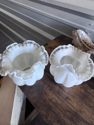 Sale Photo Thumbnail #106: A matching pair of vintage Fenton Art Glass 'Silver Crest' melon-shaped vases. These pieces feature a classic milk glass body with a ruffled, double-crimped rim accented by a clear glass edge. Made in the USA. Both vases are in good vintage condition with