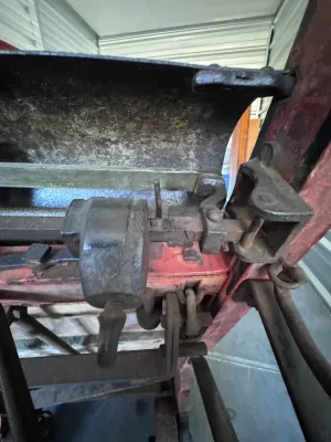 Sale Photo Thumbnail #21: An authentic antique Fairbanks wooden hand truck scale, combining a heavy-duty warehouse dolly with an integrated mechanical platform scale. Features a sturdy wood-plank bed, curved wooden handles, cast iron wheels, and the original mechanical weighing me