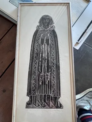 Sale Photo Thumbnail #217: A vintage framed monumental brass rubbing depicting John Sprotte (1498), Master of the College of Cobham, from Cobham Church in Kent, England. The black wax rubbing is executed on a light-colored paper or fabric backing. It is housed in a simple silver-to