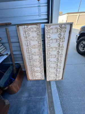 Sale Photo Thumbnail #28: A pair of decorative wall panels featuring highly detailed Gothic Revival style plaster relief friezes. The panels showcase intricate tracery, foliate motifs, and architectural elements finished in an off-white/cream tone. Each plaster section is mounted 