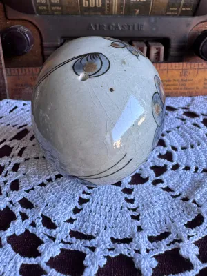 Sale Photo Thumbnail #86: A vintage hand-painted stoneware egg figurine by Ken Edwards (El Palomar), crafted in Tonala, Mexico. Features a classic bird and floral motif in muted blue, grey, and brown tones over a crackle-glazed cream background. Measures approximately 3 to 4 inche