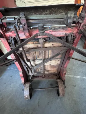 Sale Photo Thumbnail #16: An authentic antique Fairbanks wooden hand truck scale, combining a heavy-duty warehouse dolly with an integrated mechanical platform scale. Features a sturdy wood-plank bed, curved wooden handles, cast iron wheels, and the original mechanical weighing me