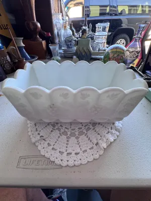 Sale Photo Thumbnail #337: A vintage milk glass rectangular planter or centerpiece bowl featuring the classic 'Paneled Grape' pattern by Westmoreland Glass. It features a scalloped rim, embossed grape clusters, and leaves on the exterior panels. The bottom interior shows the faint 