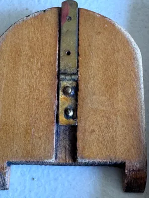 Sale Photo Thumbnail #58: An antique Chinese folding pocket sundial and compass (diptych style) crafted from wood. Features hand-painted Chinese characters, a central compass with a glass cover, and a folding metal gnomon on a hinged wooden plate. The underside and inner surfaces 