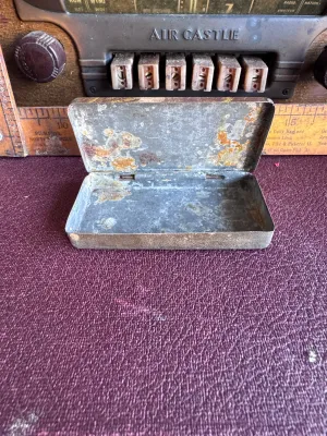 Sale Photo Thumbnail #199: An antique/vintage pocket-sized metal tobacco tin for Climax Plug tobacco, manufactured by the P. Lorillard Co. (Est. 1760) in the United States (Factory No. 10, Fifth District, N.J.). The lid features the red "CLIMAX PLUG" logo on a gold and brown stripe