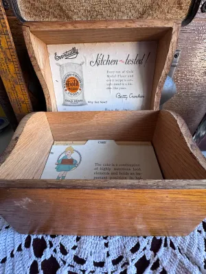 Sale Photo Thumbnail #68: An antique/vintage wooden recipe box featuring 'Gold Medal Home Service Recipes' on the front. The interior lid features original advertising for Washburn-Crosby Co. Gold Medal Foods and Betty Crocker 'Kitchen-tested' flour. Includes vintage recipe divide