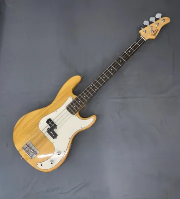 Glarry 4-string electric bass guitar with a natural wood finish body, white pickguard, and rosewood fretboard.