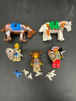Vintage Lego Western Indians minifigures and horses, including a chief with headdress, a warrior with a buffalo hat, and various...