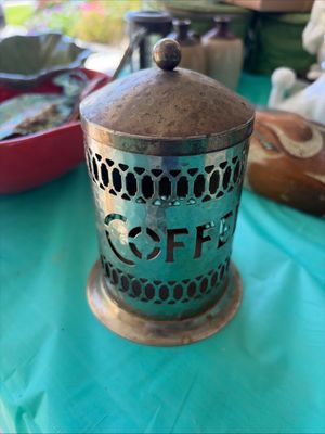 Sale Photo Thumbnail #19: Vintage hammered metal coffee canister with cutout lettering and a matching lid, showing some tarnish and wear.