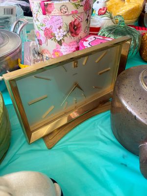 Sale Photo Thumbnail #18: Vintage mid-century modern Angelus brass desk clock, featuring a rectangular face with gold-tone hour markers and hands.