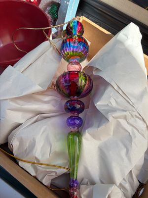 Sale Photo Thumbnail #70: Hand-blown glass finial Christmas ornament featuring vibrant, multi-colored segments in a stacked design
